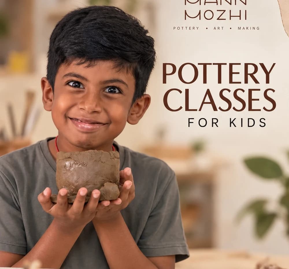 Child proudly holding a handcrafted clay vessel in Mann Mozhi pottery class