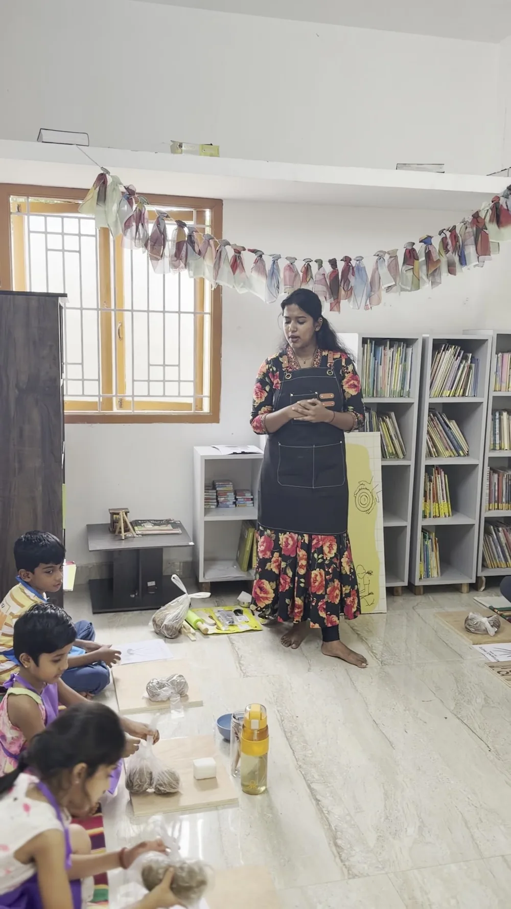 Educator Logisa conducting an engaging pottery workshop for students